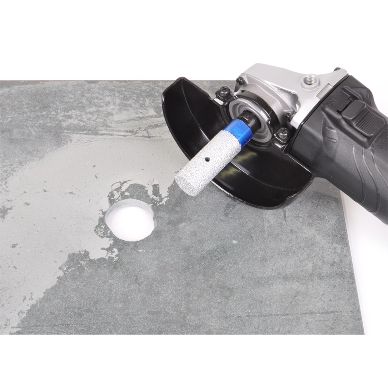 Montolit FPU Universal Diamond Milling Bit attached to Angle Grinder having enlarged a hole