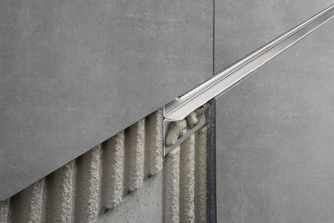 Schluter deco profile in anodised aluminium on grey tiles
